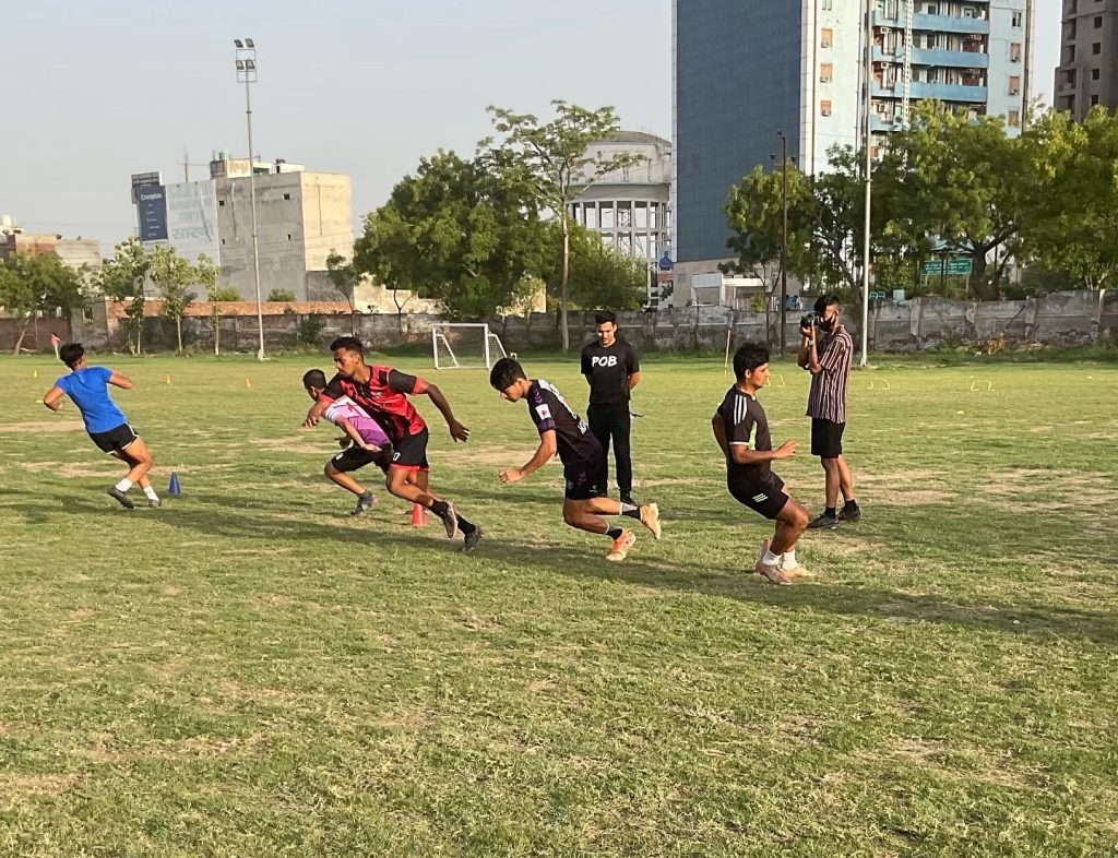playing football in summer camps